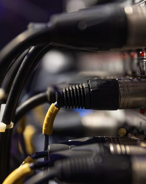 Audio snake and stage box with xlr cables and jacks at a live show.
