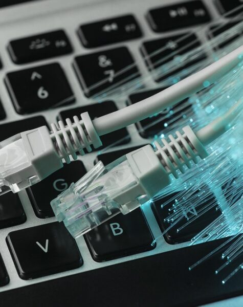 blue-optic-fiber-with-ethernet-cables-laptop