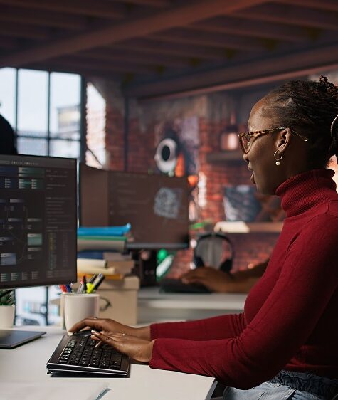Tired admin in AI startup office having strained eyesight from overworking, getting help from senior manger. Woman removing eyeglasses to rub eyes, encouraged by team leader to take break, camera A